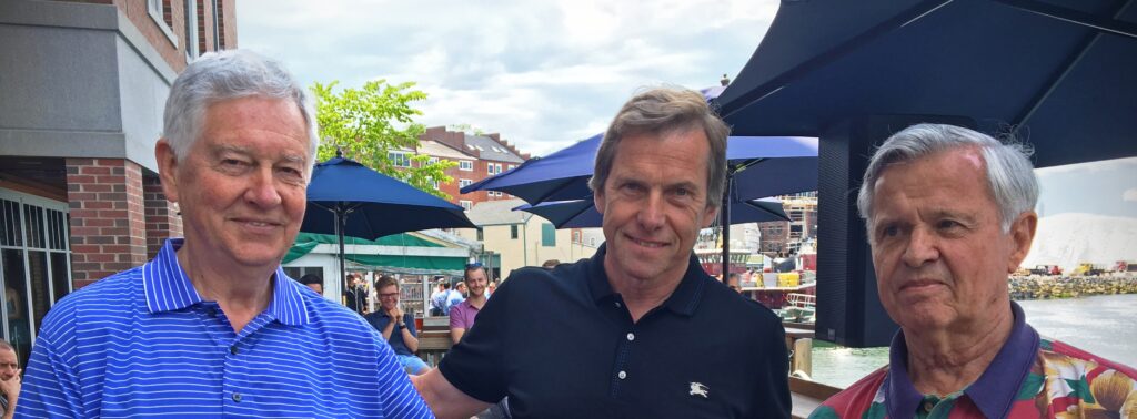 Image of Prime Buchholz Founders Jim Buchholz and Jon Prime (left and right) and President Bill McCarron at a company event.